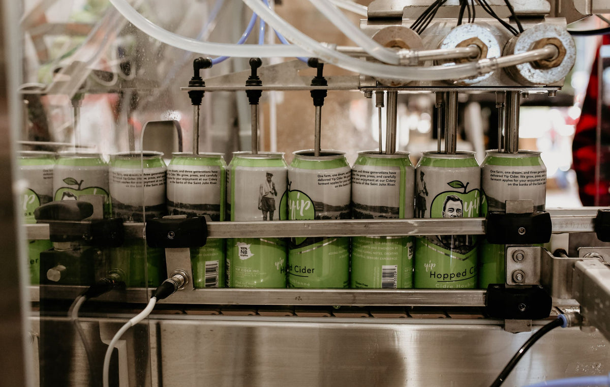 Cans moving through the Yip Cider canning line