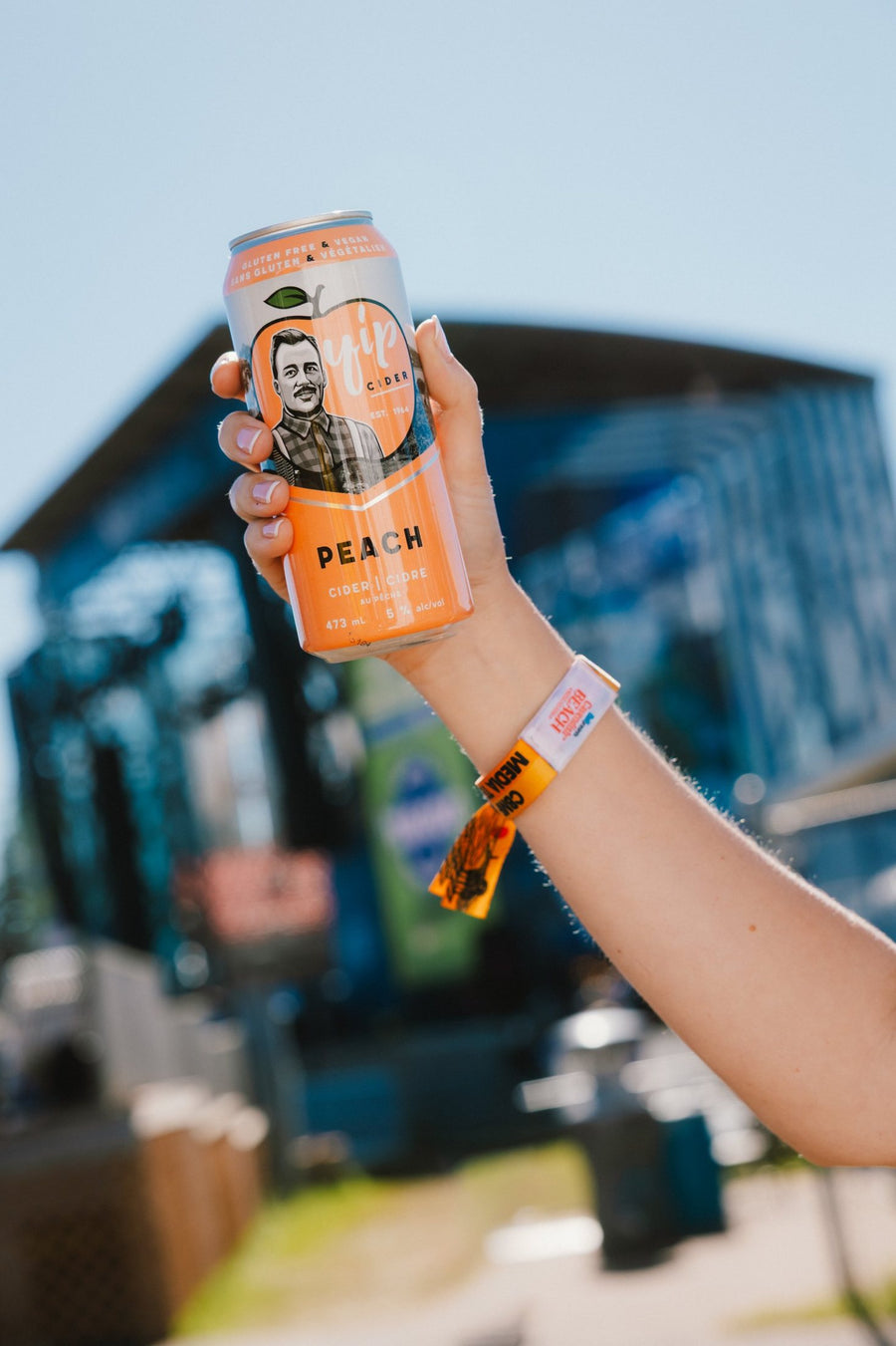 A can of Yip Peach raised in front of the Bell Stage at Cavendish Beach Music Festival